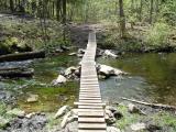 [Photo of a bridge crossing the creek]
