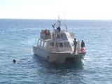 [Photo of boat coming to pick up hikers]