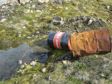 [Photo of oil drums]
